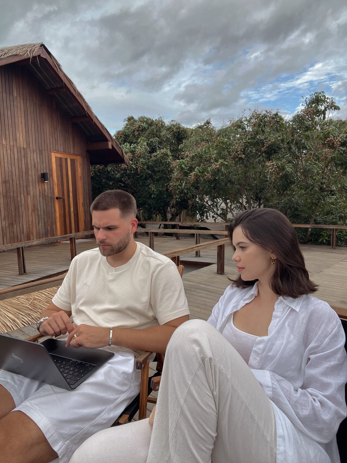 Airis checking the account on a laptop while Larianna looks on